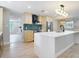 Bright kitchen with oversized island, stainless appliances, and decorative lighting at 236 N Ranger Blvd, Winter Park, FL 32792