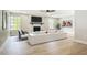 Modern living room features a fireplace, hardwood floors, and bright windows at 236 N Ranger Blvd, Winter Park, FL 32792