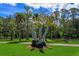 This park area offers a tranquil retreat with lush greenery and decorative dolphin statues for community enjoyment at 236 N Ranger Blvd, Winter Park, FL 32792