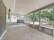 Enclosed sunroom featuring a hanging swing with views of the fenced backyard at 236 N Ranger Blvd, Winter Park, FL 32792
