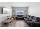Comfortable living room with contemporary furniture and hardwood-style floors at 3008 Cardillino Way, Kissimmee, FL 34741