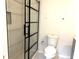 Nicely renovated bathroom featuring a glass shower door, vanity, and toilet at 604 Kenwick Cir # 105, Casselberry, FL 32707