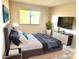Cozy bedroom featuring a comfortable bed, soft lighting, and modern decor at 604 Kenwick Cir # 105, Casselberry, FL 32707