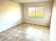 Bedroom featuring tile floors and a sunlit window at 604 Kenwick Cir # 105, Casselberry, FL 32707
