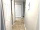 Hallway featuring tile floors, a utility box, and closet doors at 604 Kenwick Cir # 105, Casselberry, FL 32707