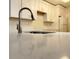 Close-up of a kitchen sink and faucet installed on a countertop at 604 Kenwick Cir # 105, Casselberry, FL 32707