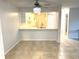Eat-in kitchen featuring tile floors and views into the kitchen at 604 Kenwick Cir # 105, Casselberry, FL 32707