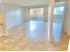 Bright living room featuring tile floors and sliding glass doors to the outside at 604 Kenwick Cir # 105, Casselberry, FL 32707