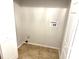 Utility room with tile flooring, washer hookups, and ample space for laundry appliances at 604 Kenwick Cir # 105, Casselberry, FL 32707