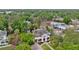 Aerial view showcasing the home's expansive lot, mature trees, and surrounding neighborhood at 690 E Church St, Bartow, FL 33830