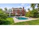 Stunning backyard featuring pool, patio, and lush landscaping at 690 E Church St, Bartow, FL 33830