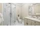 Clean bathroom featuring a glass-enclosed shower and a vanity with marble countertop at 690 E Church St, Bartow, FL 33830