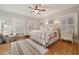 Charming bedroom with hardwood floors and white furnishings, creating a serene atmosphere at 690 E Church St, Bartow, FL 33830