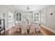 An elegant dining room with custom built-in cabinets and a beautiful chandelier at 690 E Church St, Bartow, FL 33830