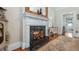 A fireplace with marble hearth, decorative mirror, and ornate mantel provides charm at 690 E Church St, Bartow, FL 33830