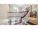 Elegant two-story foyer with hardwood floors, chandelier, and staircase at 690 E Church St, Bartow, FL 33830