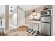 Functional kitchenette space with a mini-fridge, microwave, and charming decor at 690 E Church St, Bartow, FL 33830