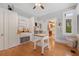 Sunlit laundry room featuring a large farmhouse sink, storage cabinets and a view to the outdoors at 690 E Church St, Bartow, FL 33830
