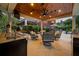 Luxurious outdoor living space with granite counters, ceiling fan, recessed lights and comfortable seating at 690 E Church St, Bartow, FL 33830