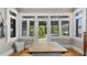 Bright sunroom with walls of windows offering serene backyard views and natural light at 690 E Church St, Bartow, FL 33830