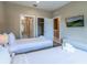 Comfortable bedroom with a dresser, a TV, and access to a closet and ensuite bathroom at 7672 Amazonas St, Kissimmee, FL 34747