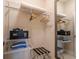 Organized closet with shelving, hanging racks, and a safe, offering ample storage and security at 7672 Amazonas St, Kissimmee, FL 34747