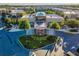 Stunning community clubhouse surrounded by lush landscaping and vibrant greenery at 7672 Amazonas St, Kissimmee, FL 34747