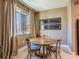 Charming dining area with a wooden table and natural light, perfect for intimate meals and gatherings at 7672 Amazonas St, Kissimmee, FL 34747