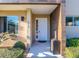 Inviting front entrance with modern door and manicured landscaping at 7672 Amazonas St, Kissimmee, FL 34747