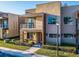 Modern townhome with stone accents, balcony, manicured lawn at 7672 Amazonas St, Kissimmee, FL 34747