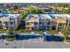 Beautiful exterior view of modern townhomes with stone accents and manicured landscaping at 7672 Amazonas St, Kissimmee, FL 34747