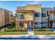 Modern two-story home with a stone accent wall and balcony at 7672 Amazonas St, Kissimmee, FL 34747