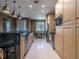 Modern kitchen with stainless steel appliances and granite countertop at 7672 Amazonas St, Kissimmee, FL 34747