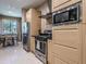 Modern kitchen featuring stainless steel appliances and light wood cabinets at 7672 Amazonas St, Kissimmee, FL 34747