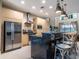 Modern kitchen with stainless steel appliances and a dark granite island at 7672 Amazonas St, Kissimmee, FL 34747