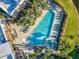 Overhead view of a gorgeous community pool with palm trees and lounge chairs at 7672 Amazonas St, Kissimmee, FL 34747