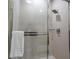 Modern glass-enclosed shower with a towel rack and a chrome shower head offers a spa-like experience at 7672 Amazonas St, Kissimmee, FL 34747