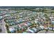 Birds eye community view with colorful houses showing the layout and many parking spaces around the neighborhood at 8044 Lost Shaker Ln, Kissimmee, FL 34747