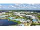 Stunning aerial view of the resort community showcasing the expansive pool area, lake, and lush green surroundings at 8044 Lost Shaker Ln, Kissimmee, FL 34747