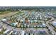 Aerial view showcasing the colorful homes in the community, highlighting its proximity to amenities and vibrant surroundings at 8044 Lost Shaker Ln, Kissimmee, FL 34747