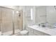 Bathroom featuring a glass door shower, toilet, and vanity with a light countertop at 8044 Lost Shaker Ln, Kissimmee, FL 34747