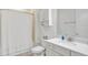 Bright bathroom with a shower-tub combination, white vanity, and plenty of storage space at 8044 Lost Shaker Ln, Kissimmee, FL 34747