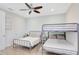 Charming bedroom with a bunk bed and single bed, perfect for children or guests at 8044 Lost Shaker Ln, Kissimmee, FL 34747