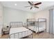 Charming bedroom with a bunk bed and single bed, perfect for children or guests at 8044 Lost Shaker Ln, Kissimmee, FL 34747