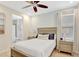 Comfortable bedroom with ensuite bathroom, wooden bed frame, and tranquil decor at 8044 Lost Shaker Ln, Kissimmee, FL 34747