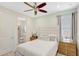 Bedroom featuring neutral tones and a glimpse into an attached bathroom at 8044 Lost Shaker Ln, Kissimmee, FL 34747