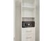Organized closet space with shelves, drawers, and a built-in safe for storing valuables at 8044 Lost Shaker Ln, Kissimmee, FL 34747