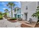 Exterior featuring colorful beach homes, manicured landscaping, and outdoor patios at 8044 Lost Shaker Ln, Kissimmee, FL 34747