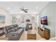 Inviting living room with modern decor, plush seating, and easy access to the kitchen and dining areas at 8044 Lost Shaker Ln, Kissimmee, FL 34747