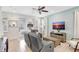 Cozy living room with a comfortable couch, TV, and easy access to the front entrance at 8044 Lost Shaker Ln, Kissimmee, FL 34747